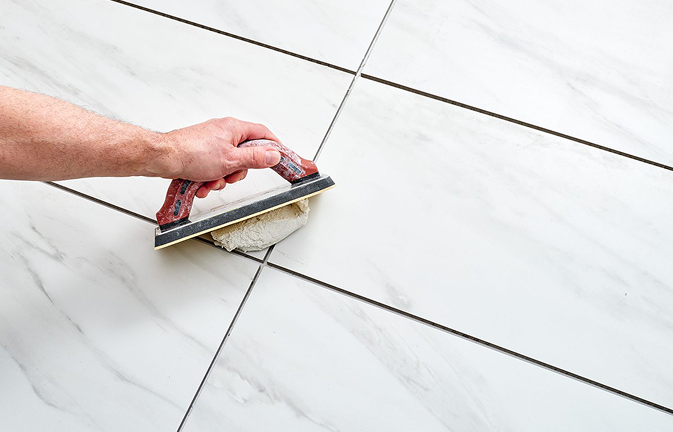 Grouting glazed tiles